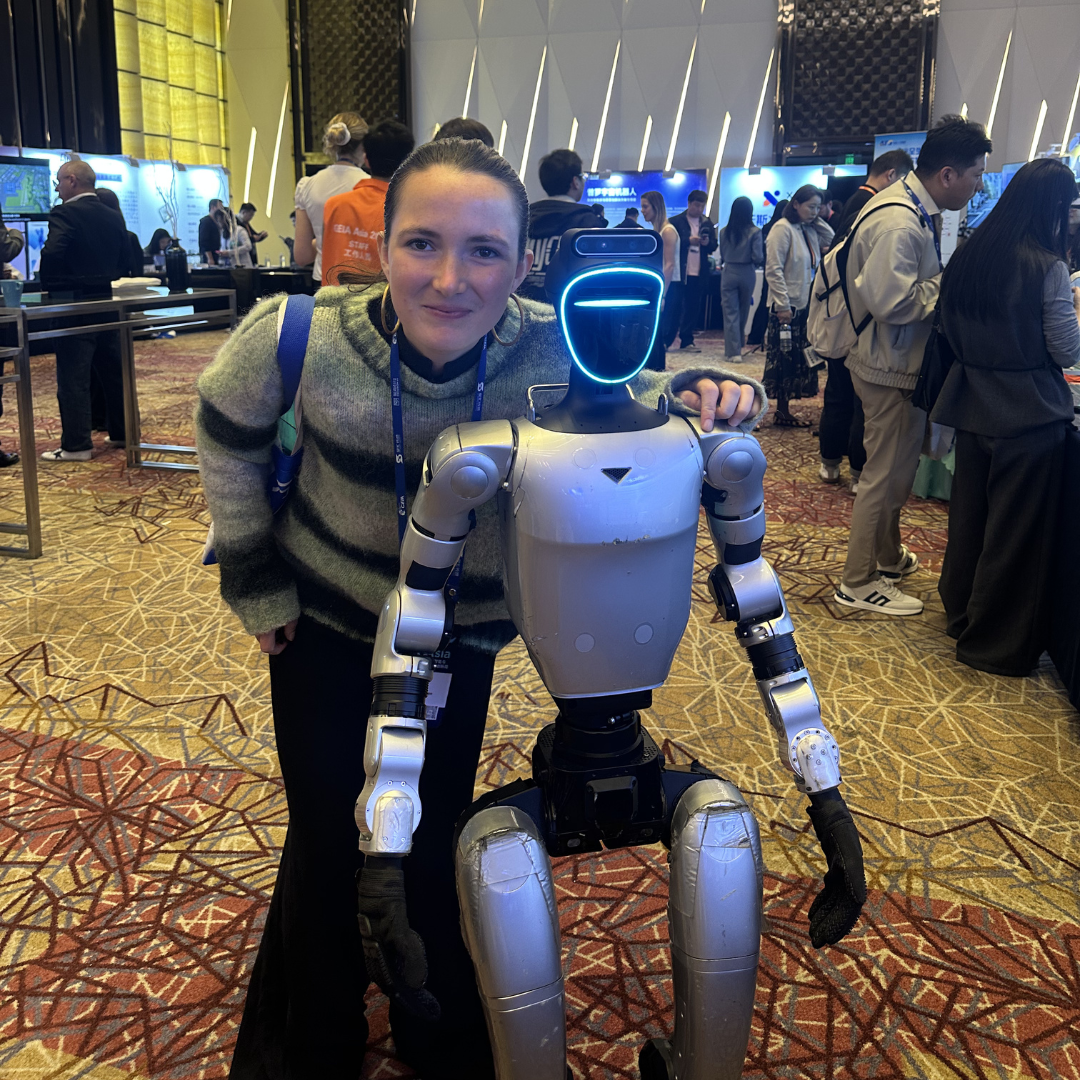 INSEAD MAster in Management (MIM) student with a robot in China